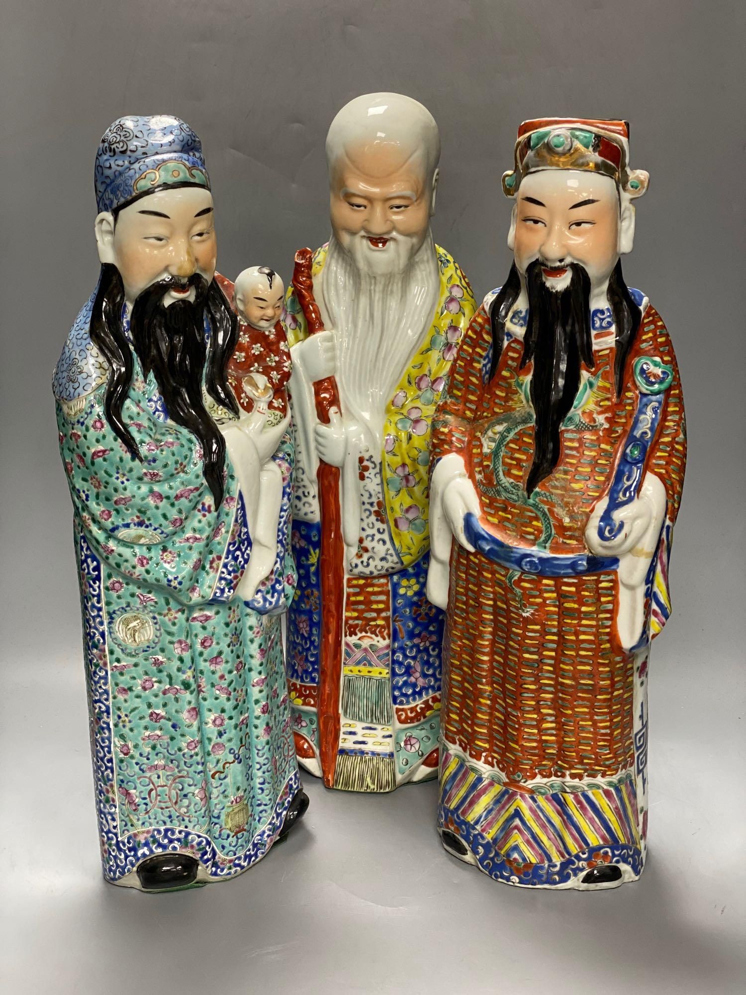 A group of three Chinese porcelain immortals, 47cm